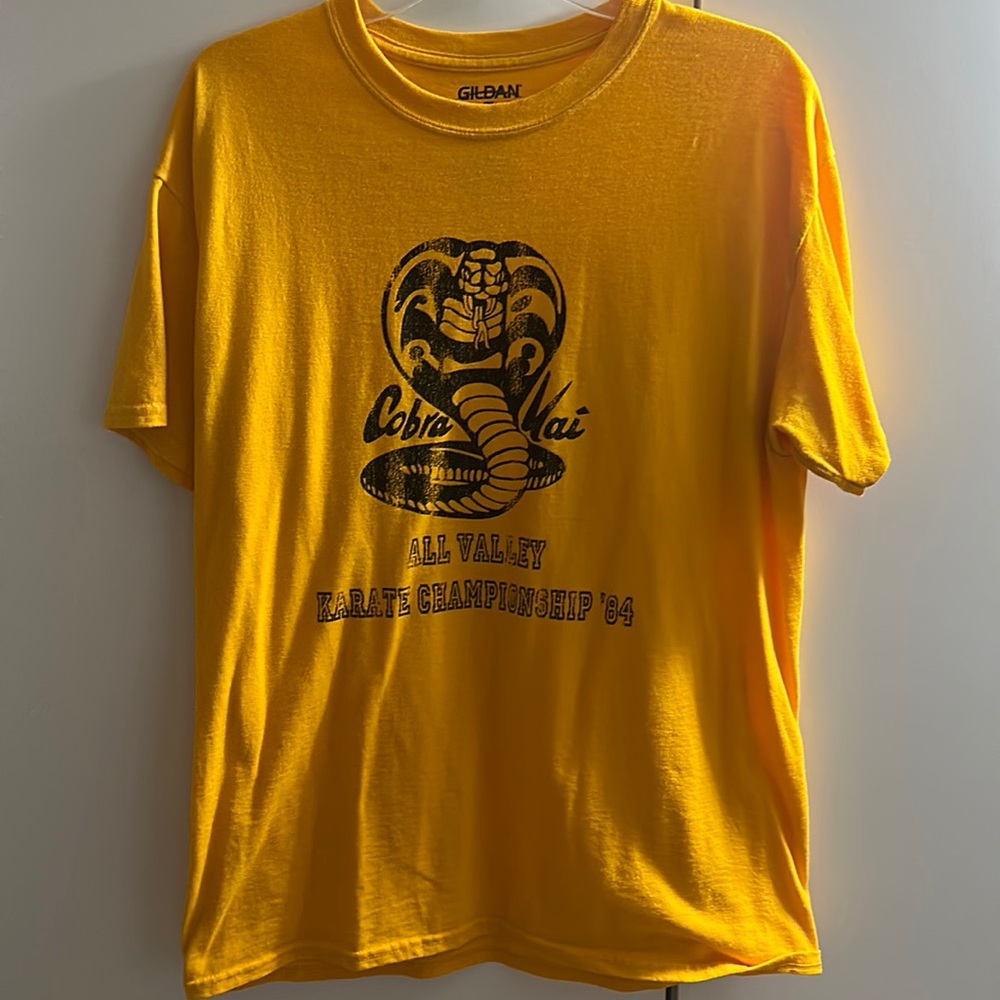 Men’s gold “Cobra Kai” tshirt. Worn once. Size L.